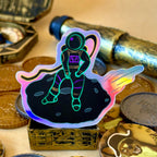 Falling Astronaut on a rock holographic sticker, with treasure surrounding it 
