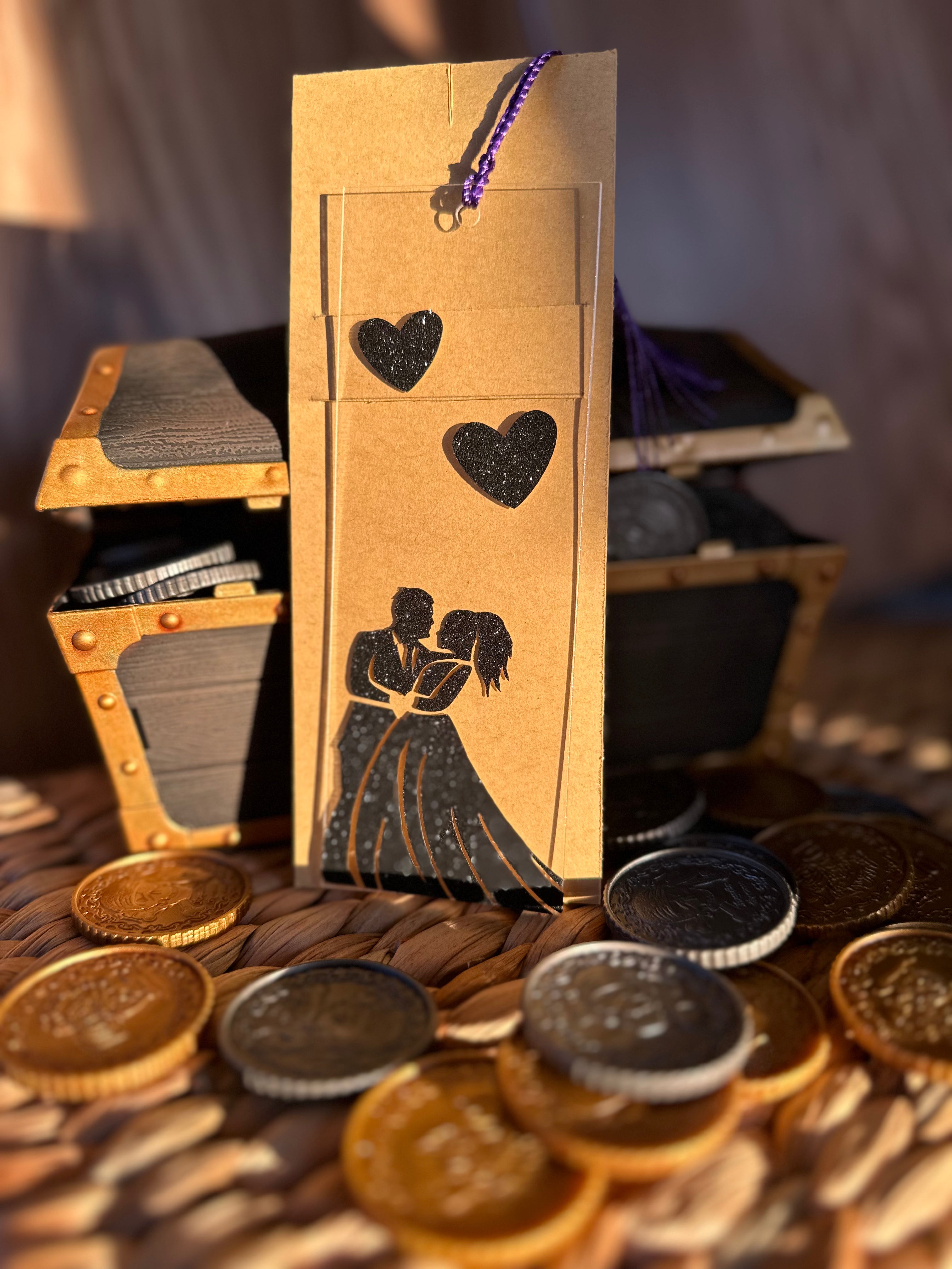 Couple dancing with black shimmer vinyl on an Acrylic bookmark surrounded by treasure