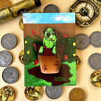 Cattle Dog Flash in a pot plant post card surrounded by pirate treasure