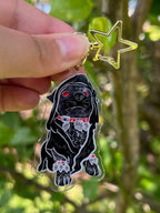 Gothic Bulldog Acrylic Keychain with a star clasp photo outdoors