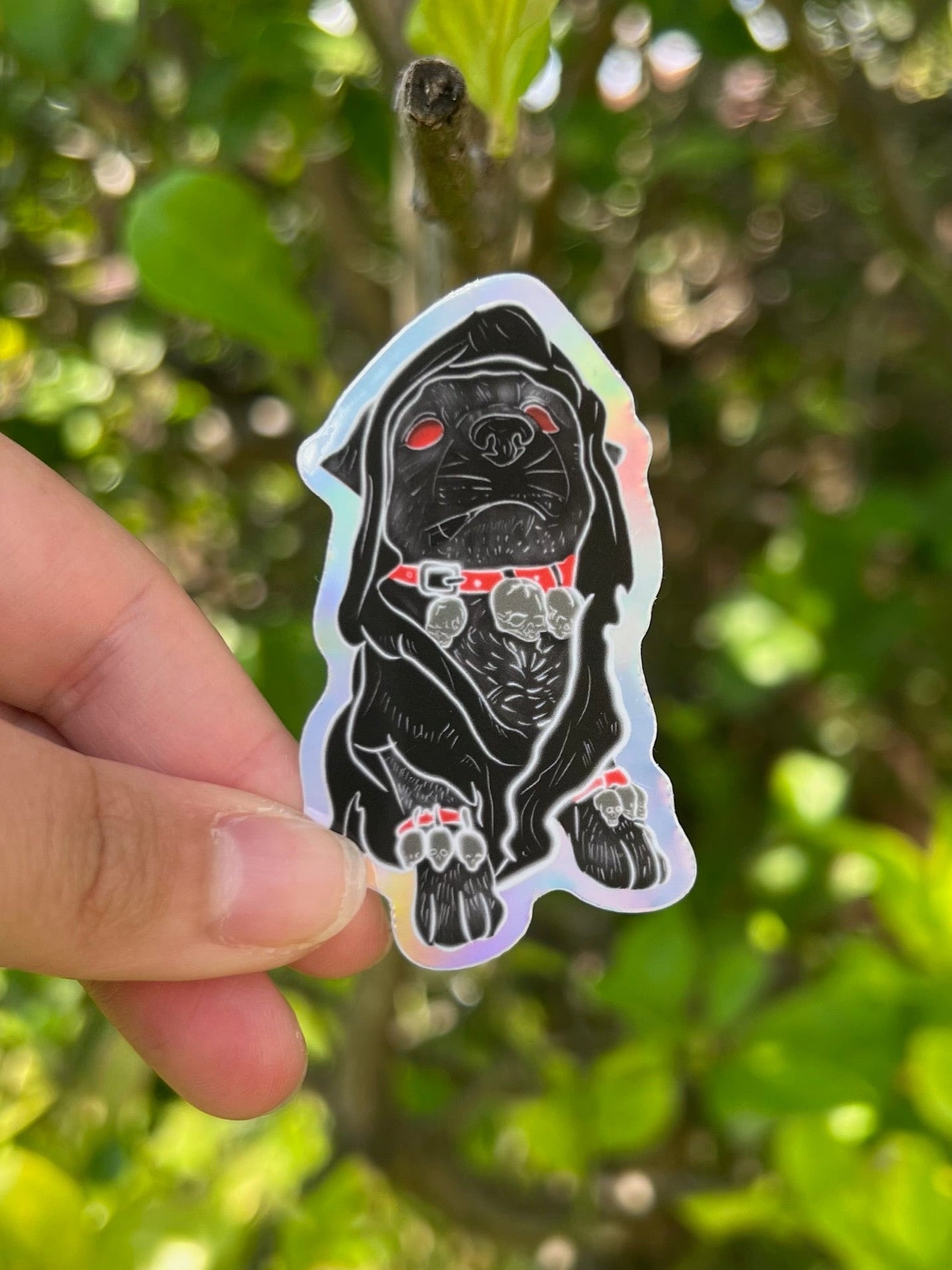Gothic Bulldog Holographic Sticker taken outdoors