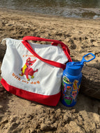 Chihuahua Large Tote Bag that says "I'd Rather be with my dog" sitting on a beach