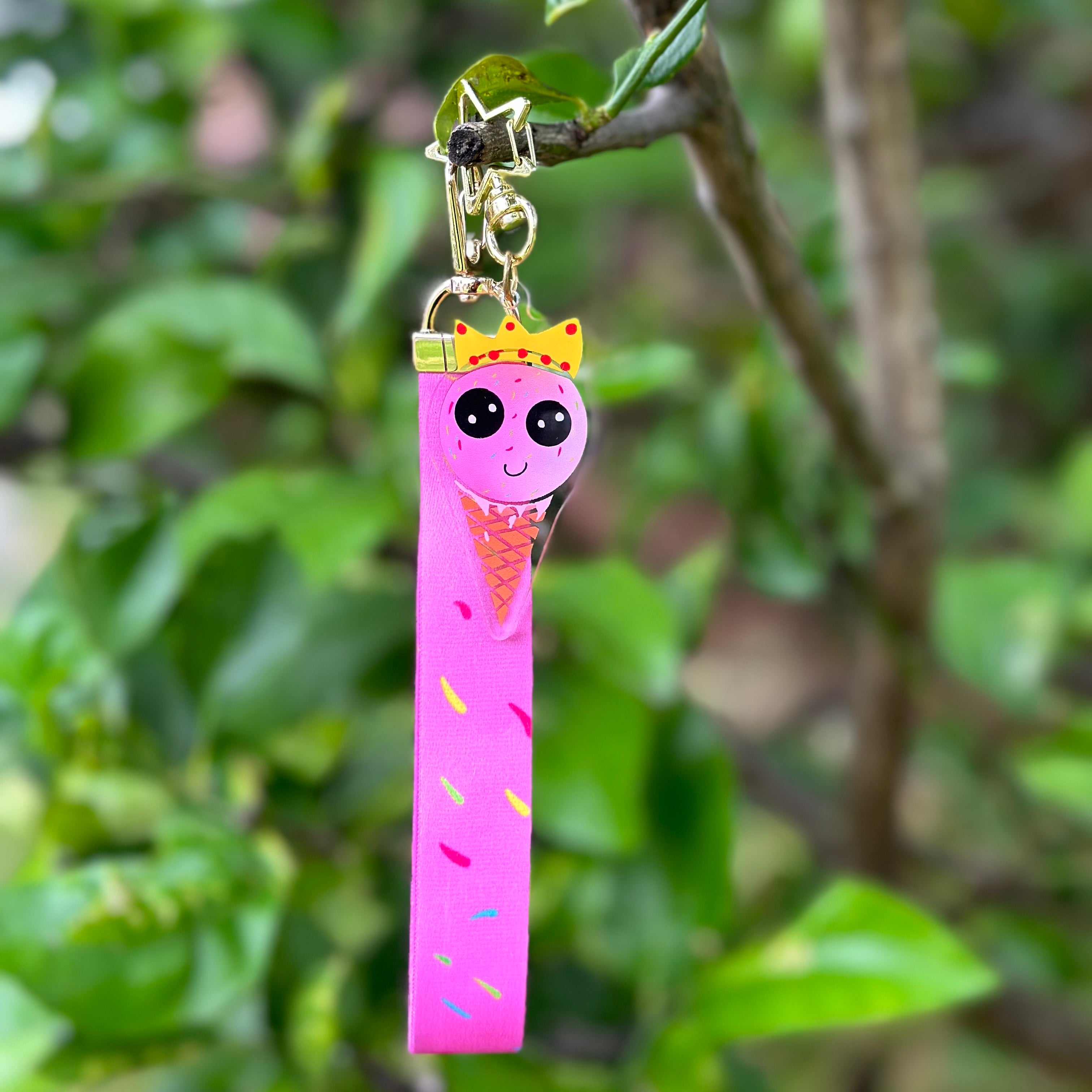 Strawberry Ice Cream wearing a crown Queen acrylic keychain with a pink sprinkles lanyard