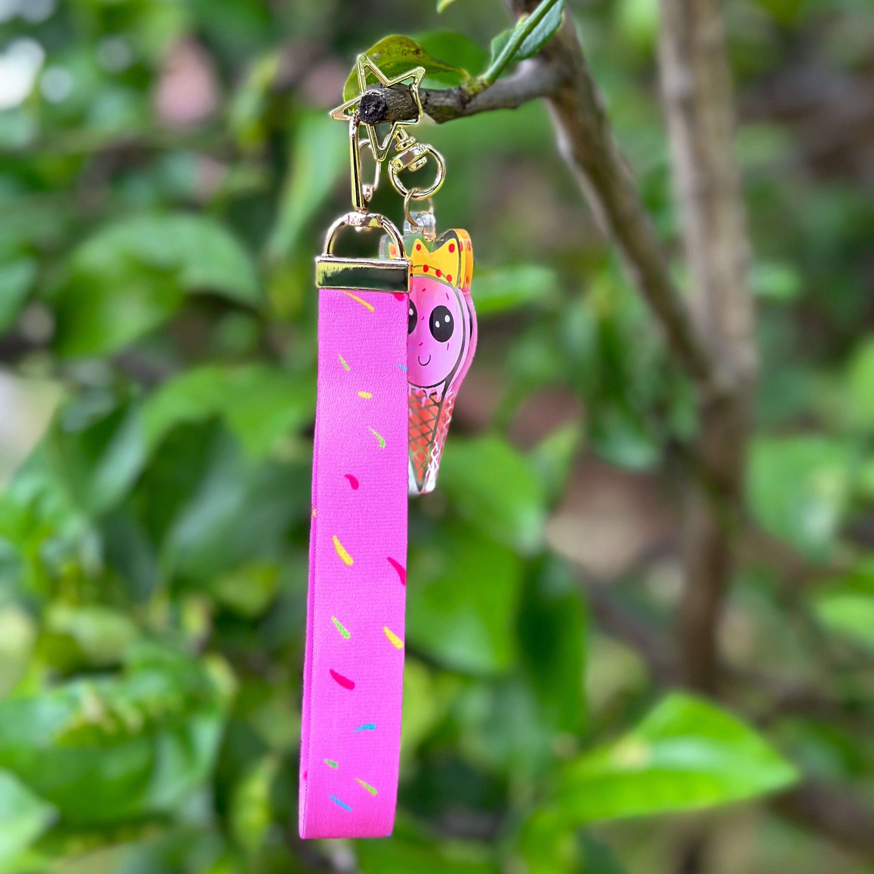 Strawberry Ice Cream wearing a crown Queen acrylic keychain with a pink sprinkles lanyard