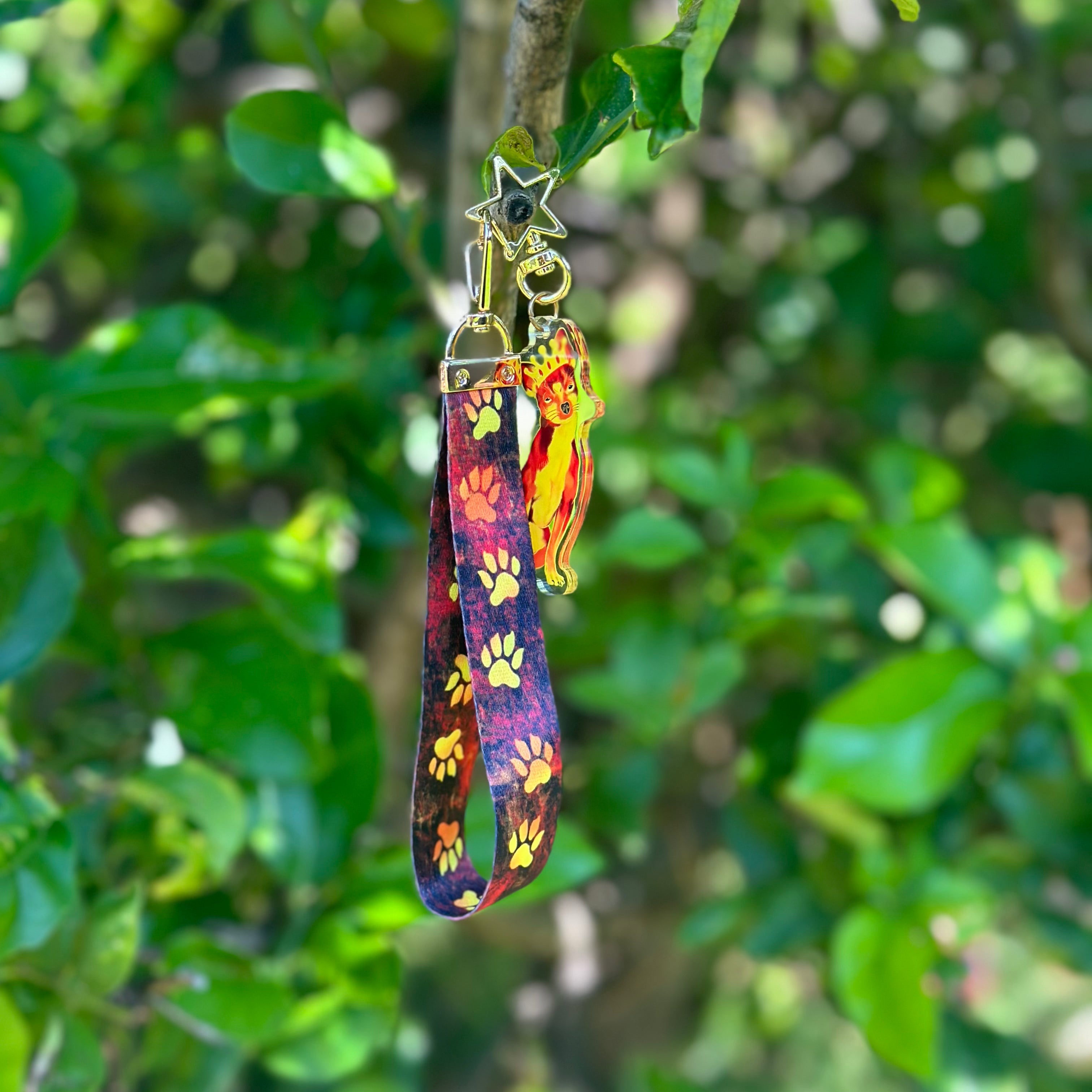 Queen Chihuahua Fiery Crown Acrylic Keychain with a fiery lanyard that features fire dog paws 