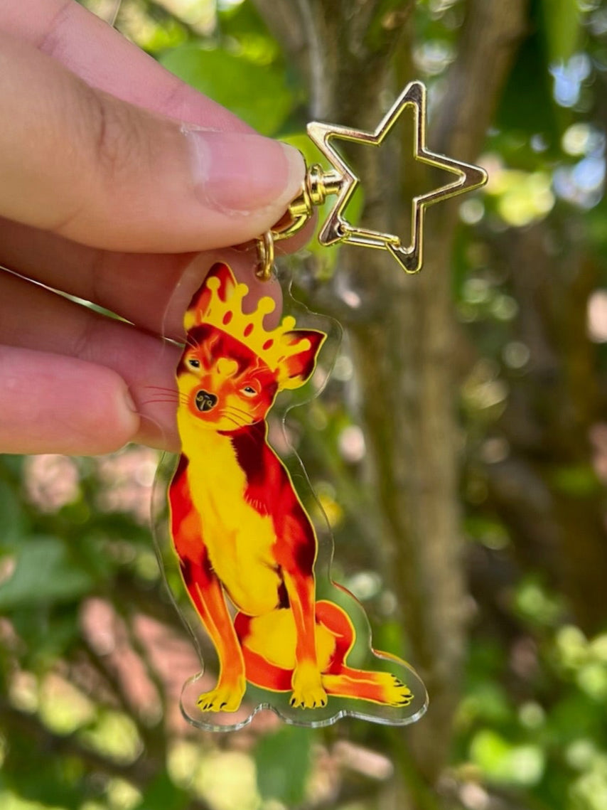 Queen Punk the Fiery Chihuahua Acrylic Keychain with a star clasp taken outdoors