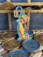 Queen Punk the Fiery Chihuahua Holographic Sticker leaning on a treasure chest with some pirate coins 