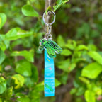 Cute Sea Turtle with it's Tongue Poking Out Acrylic Holographic Keychain, with a Lanyard full of ocean animals like fish seahorse and turtles. 
