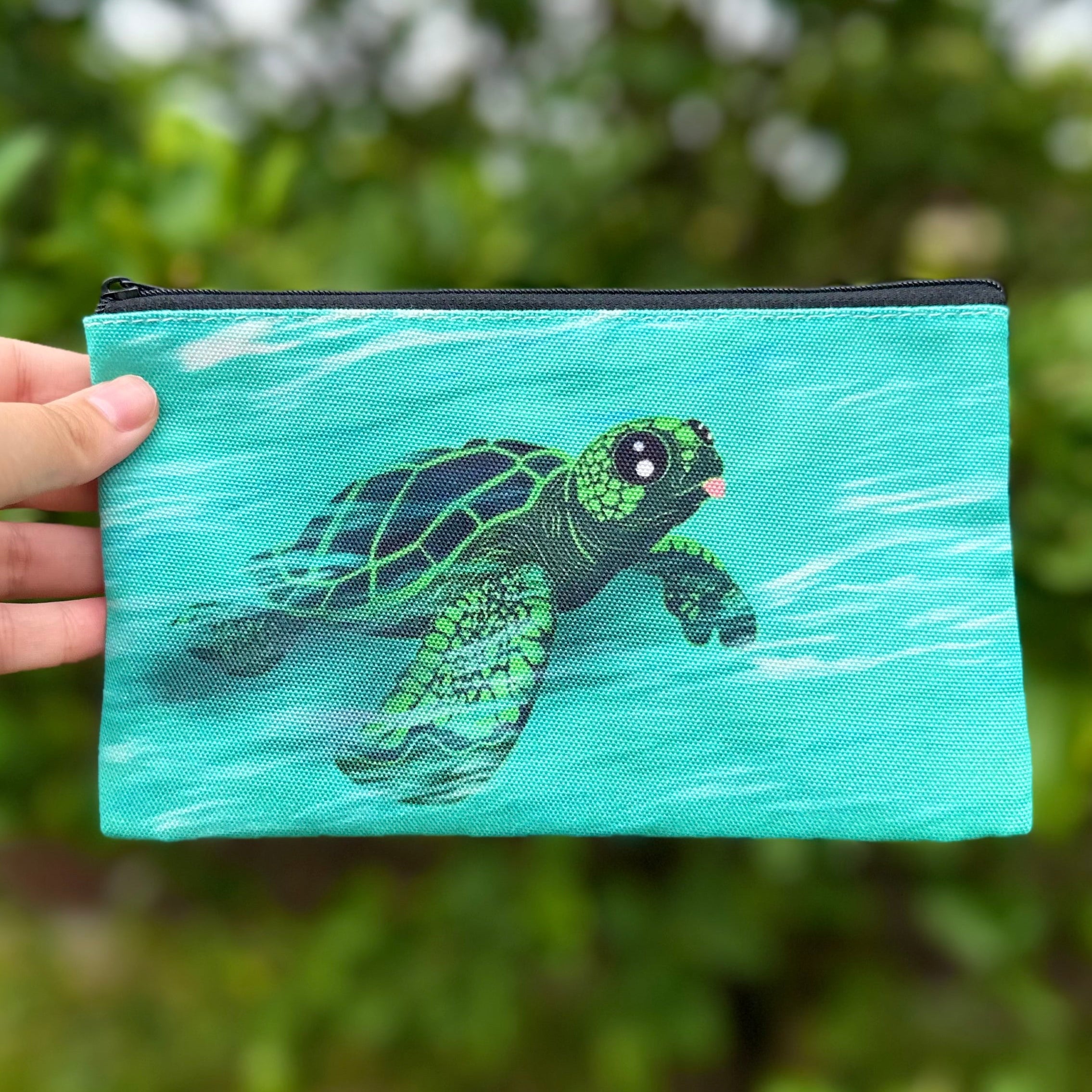 Sea Turtle swimming in the ocean with it's tongue sticking out Pouch