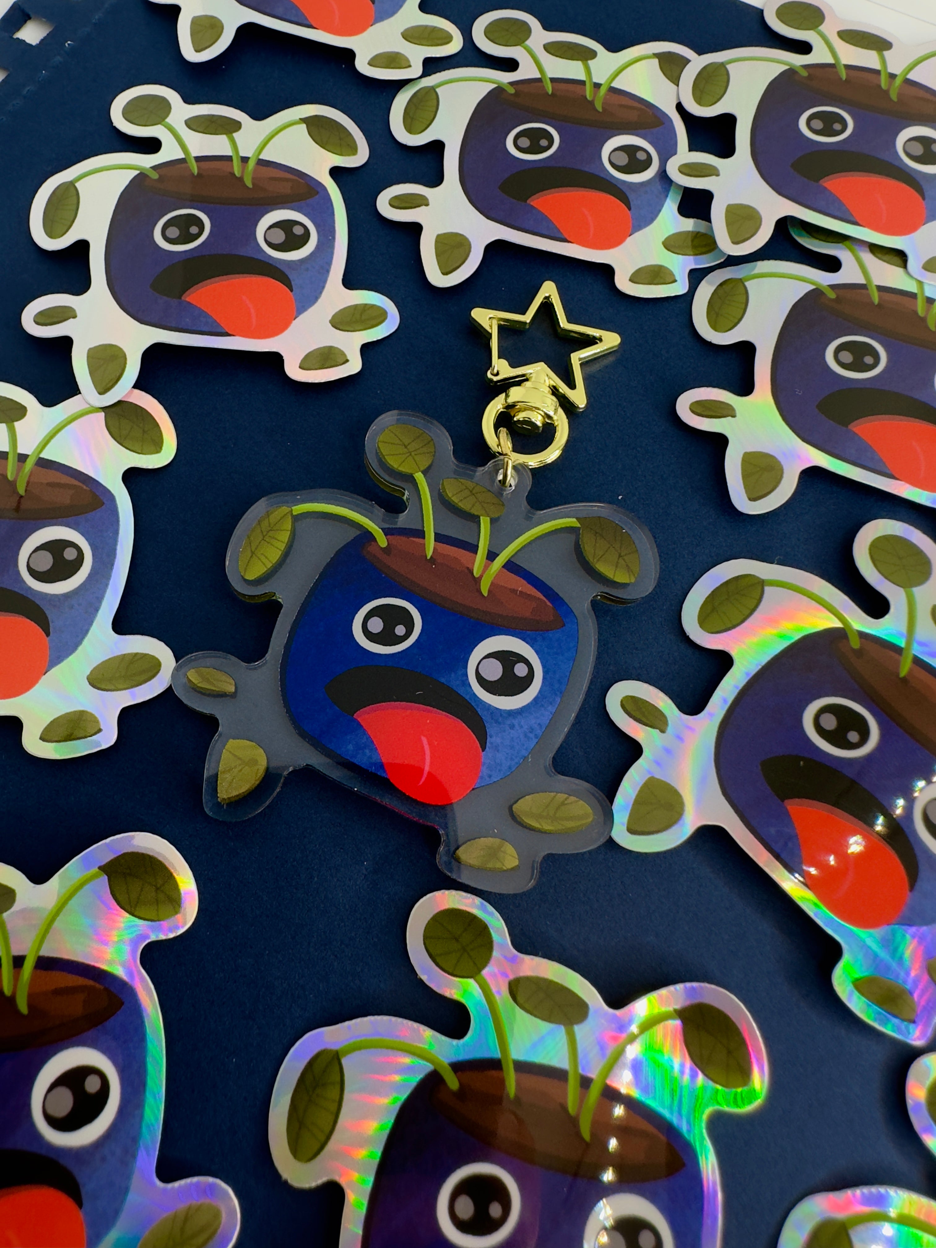 THirsty Pot Plant Acrylic Keychain surrounded by Thirsty Pot Plant Stickers