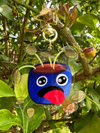 Pot Plant Keychain Hanging off a tree looking dehydrated