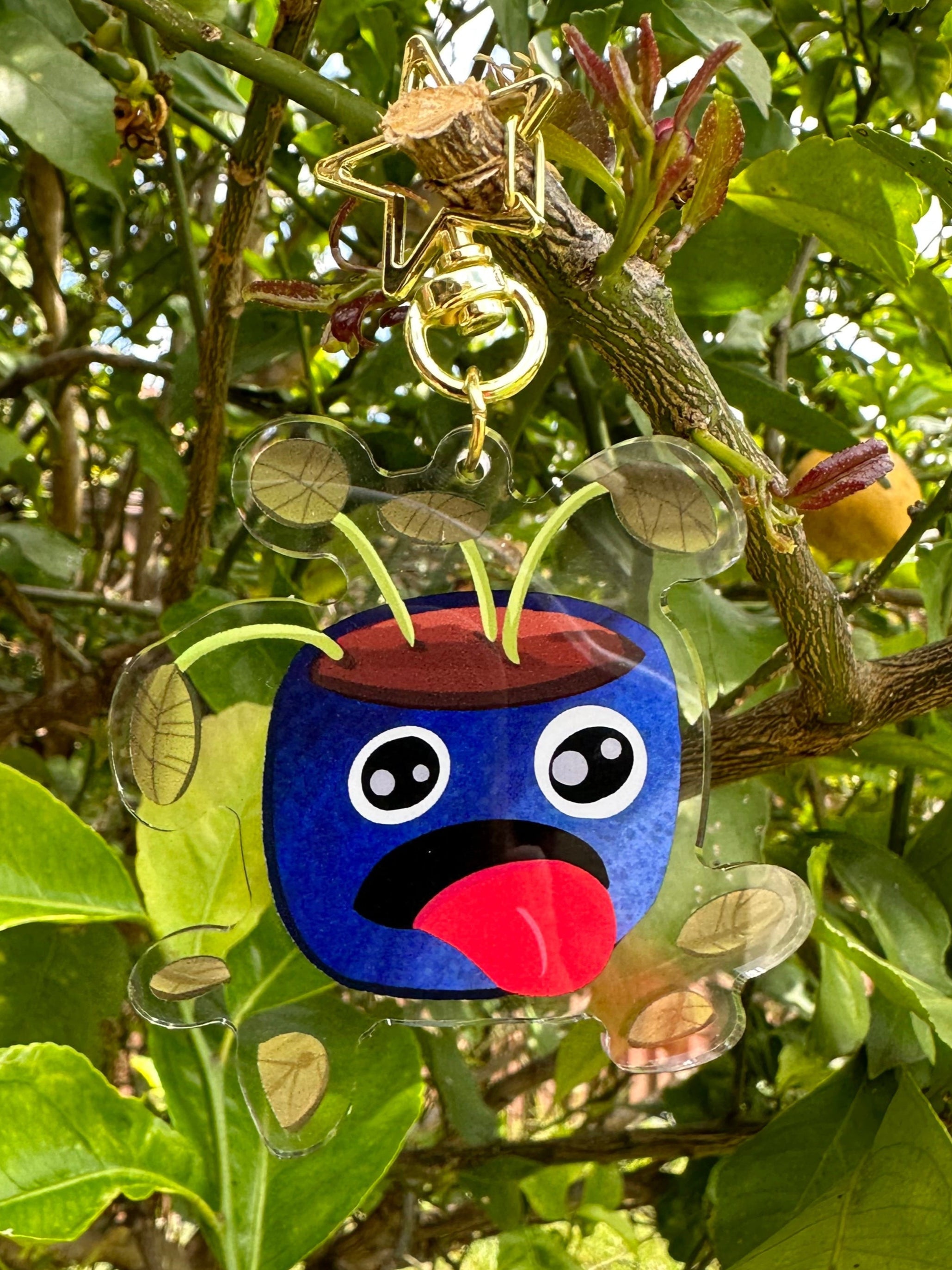 Pot Plant Keychain Hanging off a tree looking dehydrated