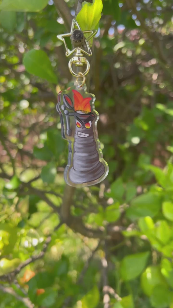 Angry Kettle Acrylic Keychain outdoors being shown both ways