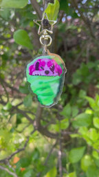 Cotton Candy Sandy Pink King Cavalier in Green Cotton Cany Acrylic Keychain outdoors being shown both sides