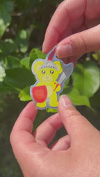 Yellow Bear Shining Knight Holographic Sticker shining in the sun outdoors