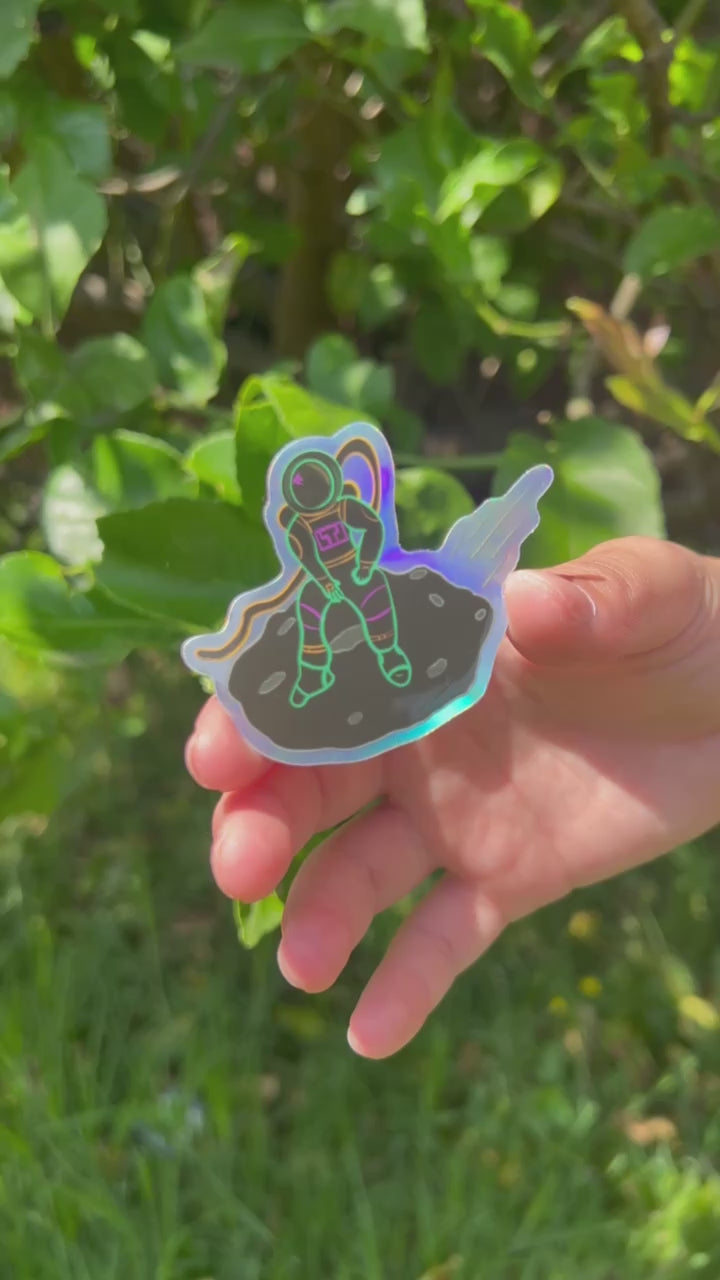 Spaceman Holographic Sticker shining in the outdoor sun