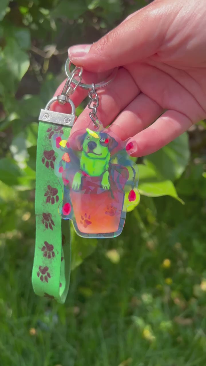 Cattle Dog Pot Plant Flash Holographic Acrylic Keychain, with a green kanyard that has paw prints on it.