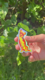 Holographic Sticker of Queen Punk the Fiery Chihuahua Shinining in the sun outdoors